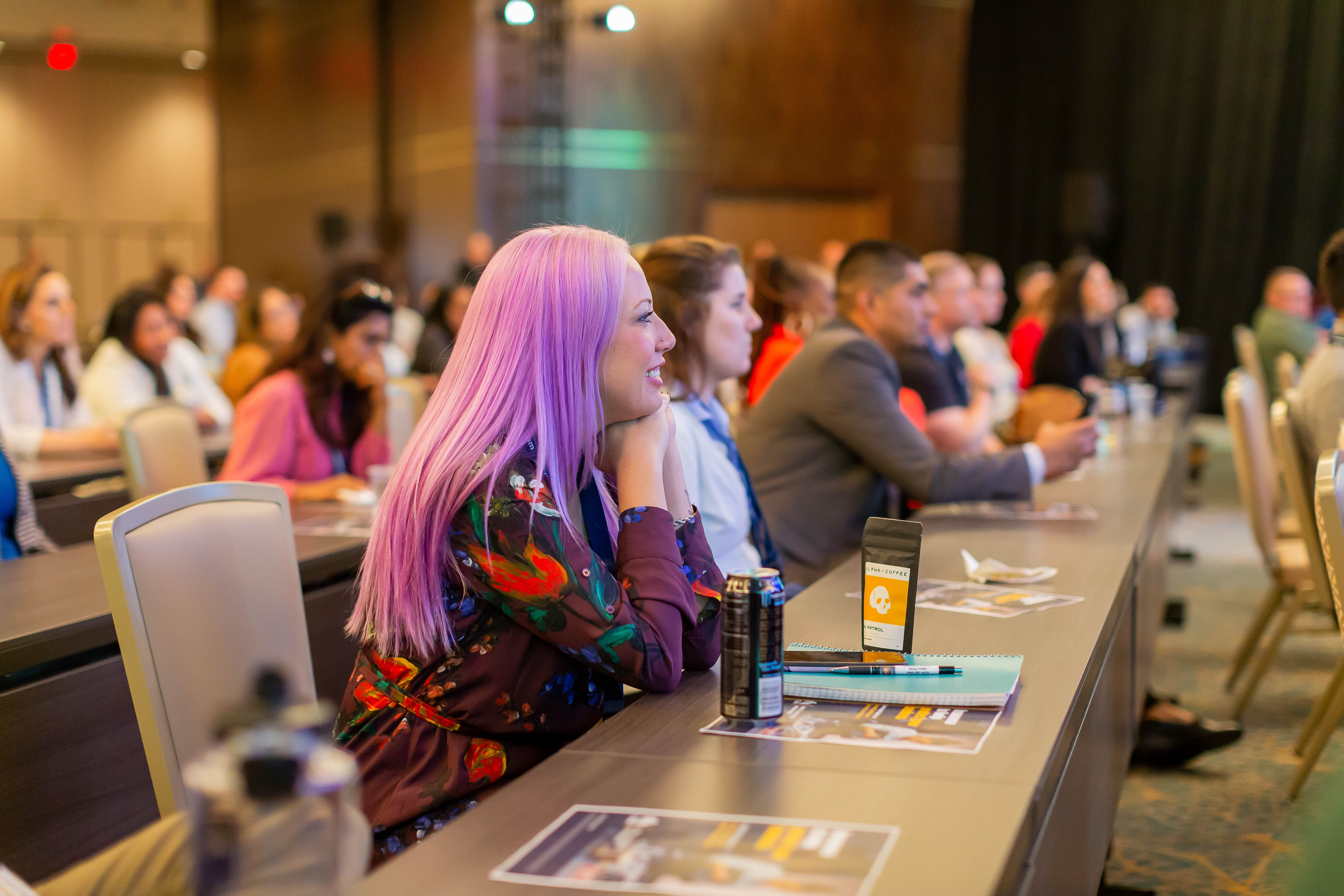 Attendees listening to a session at a Military Creator event