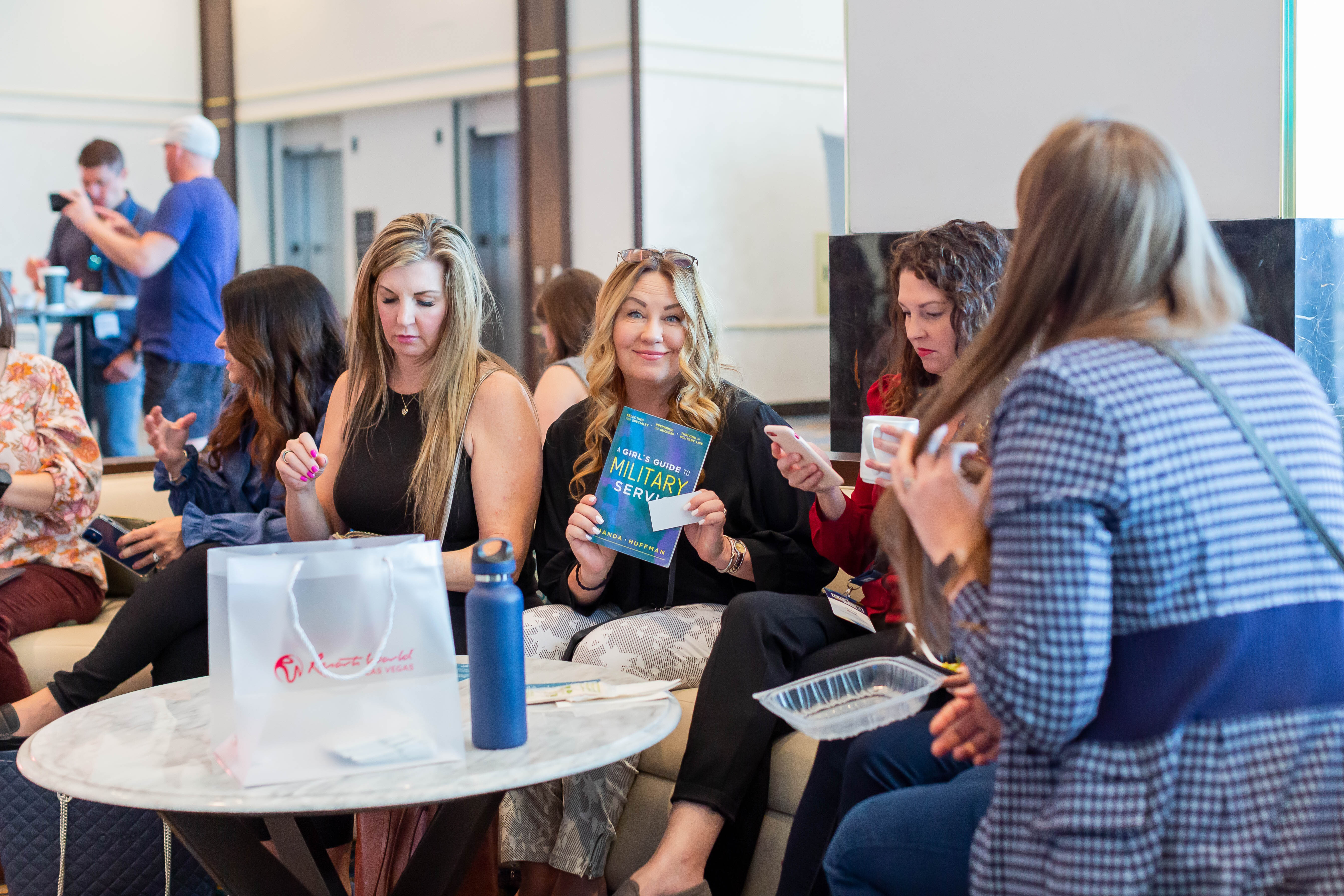Attendees connecting over coffee between sessions